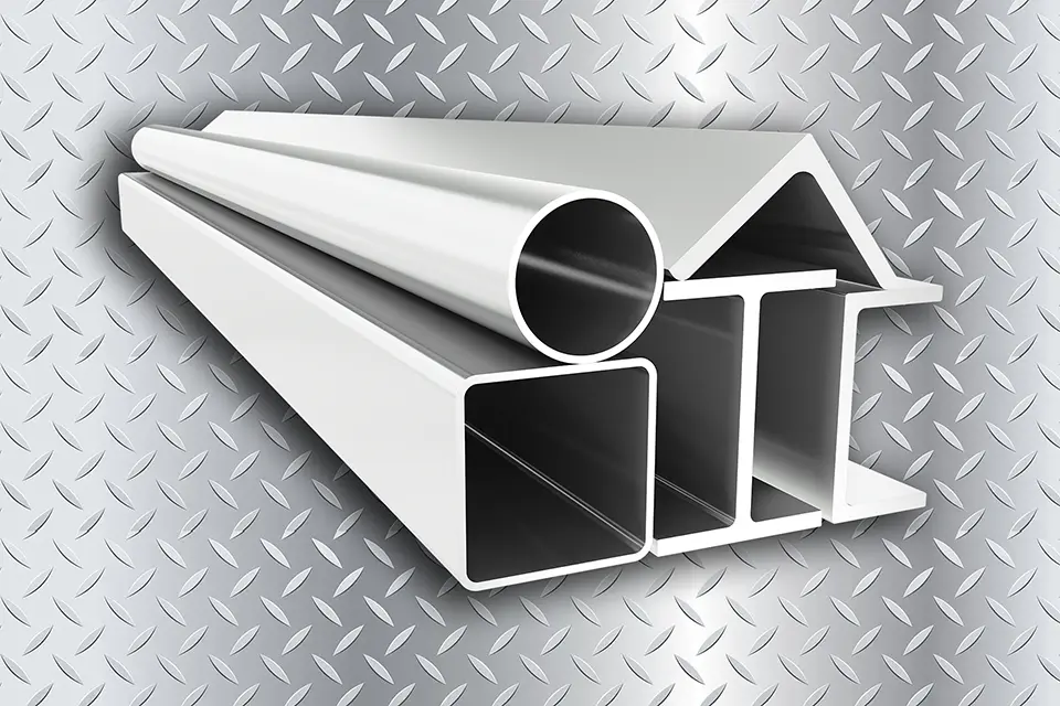 stack of aluminum extrusions with diamond tread background